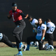 Quarterback Cam Newton of the Carolina Panthers gives the Heisman Trophy pose while his teammates stretch during practice at San Jose State University on Feb. 5, 2016, California.
Thearon W. Henderson/Getty Images